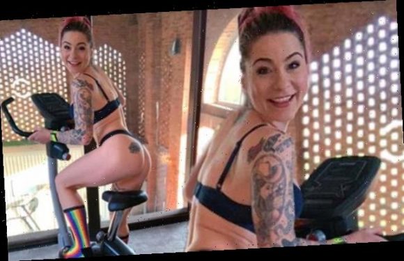 Lucy Spraggan cheekily poses in her underwear on an indoor bike