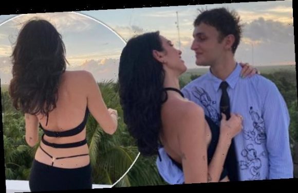 Dua Lipa wears 'thong dress' as she packs on the PDA with Anwar Hadid