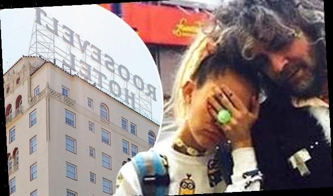 Miley Cyrus says that she was NAKED when she climbed a hotel sign