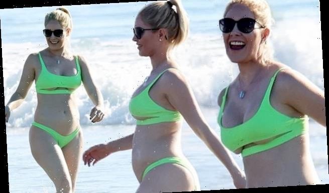 Heidi Pratt strips down to a green bikini during beach day with family