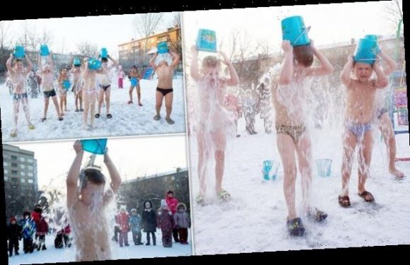 Siberian school children douse themselves with a bucket of ICY WATER