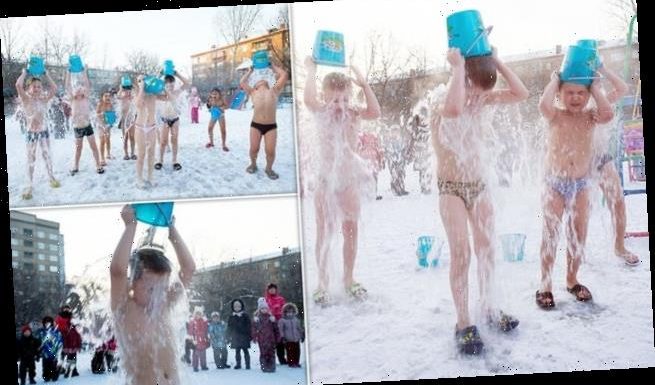 Siberian school children douse themselves with a bucket of ICY WATER