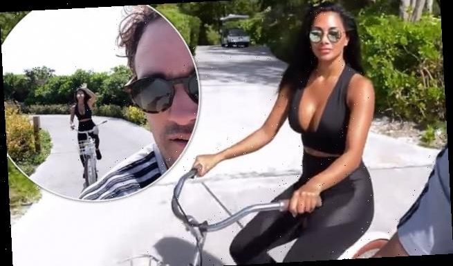 Nicole Scherzinger enjoys bike ride with beau Thom Evans on holiday