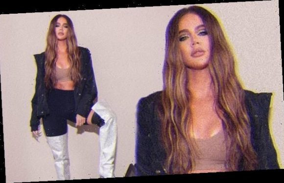 Khloe Kardashian showcases her washboard abs in a nude crop top