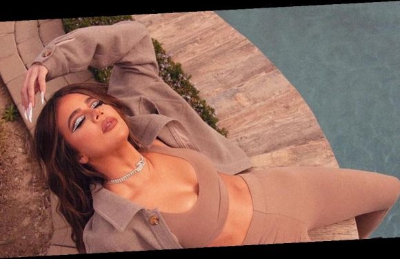 Khloé Kardashian’s Latest Mirror Selfie Takes a Style Cue From J.Lo