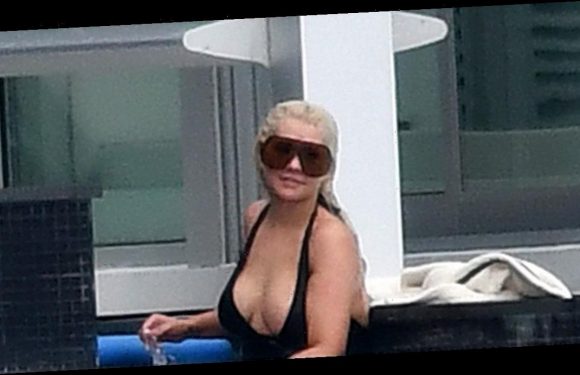 Christina Aguilera shows off eye-popping cleavage in sizzling swimsuit display