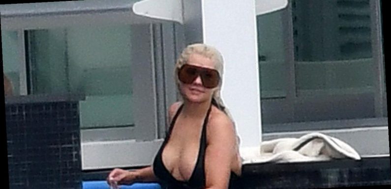 Christina Aguilera shows off eye-popping cleavage in sizzling swimsuit display