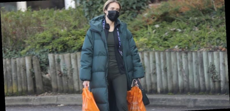 Megan McKenna wraps up warm in padded winter coat as she does food shop in Essex