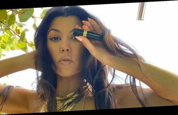 Kourtney Kardashian risks wardrobe malfunction while wearing tiny gold bikini