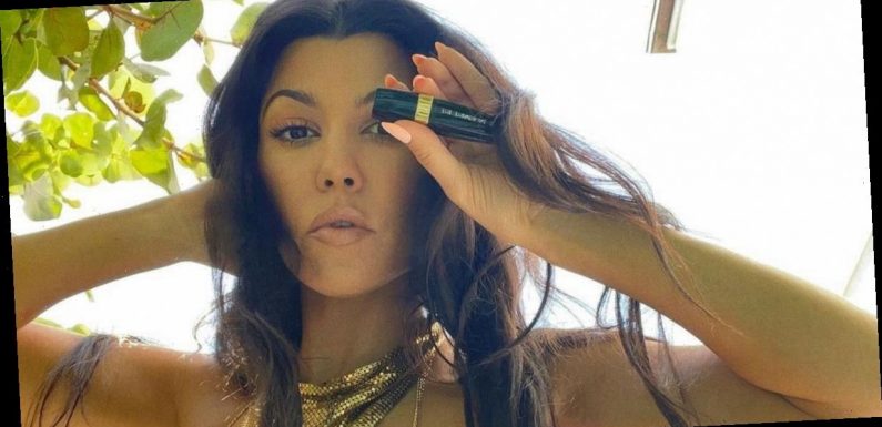 Kourtney Kardashian risks wardrobe malfunction while wearing tiny gold bikini