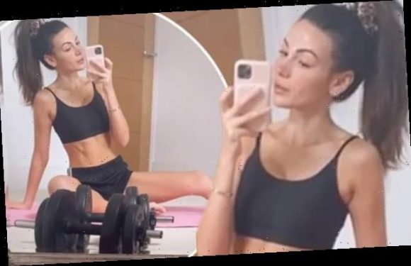 Michelle Keegan shows off her toned abs in a crop top and shorts