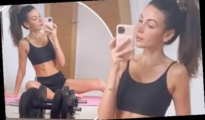 Michelle Keegan shows off her toned abs in a crop top and shorts