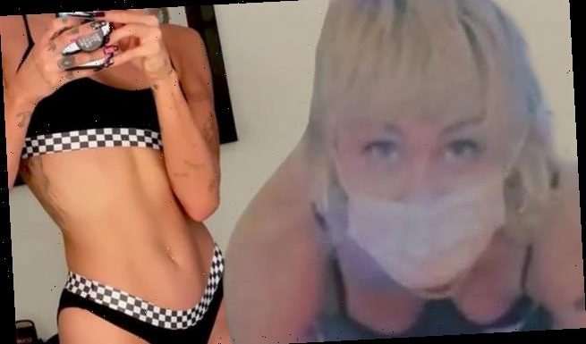 Miley Cyrus shows off her rock-solid curves in underwear and bra