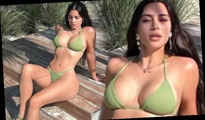 Kim Kardashian puts her ample assets on display in a green bikini