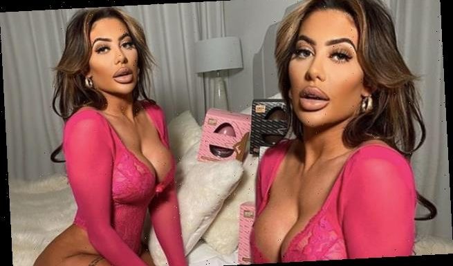Chloe Ferry flaunts her ample assets in hot pink lace bodysuit