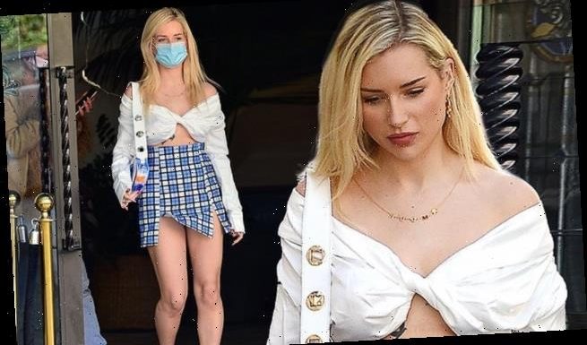 EXCLUSIVE: Lottie Moss puts on a leggy display in a plaid mini skirt