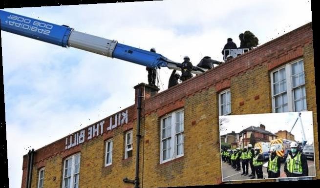 Bailiffs remove squatters from former police station roof in Clapham