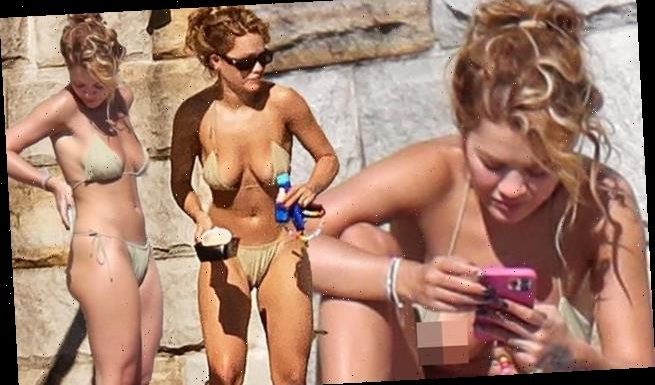 Rita Ora wears gold bikini as she sunbathes in Sydney