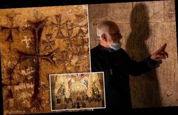 Crosses etched in Church of Holy Sepulchre carved by medieval masons