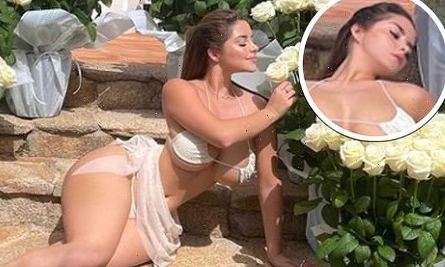 Demi Rose barely contains her ample assets in a TINY white bikini