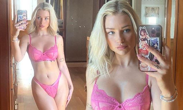 Lottie Moss shows off her hourglass curves in sizzling pink lingerie