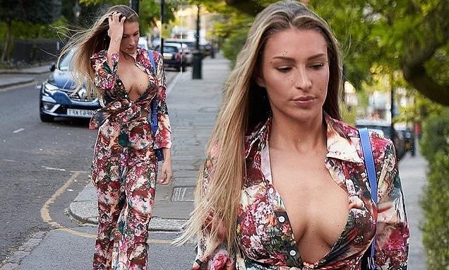 Zara McDermott flaunts her cleavage in a plunging floral shirt