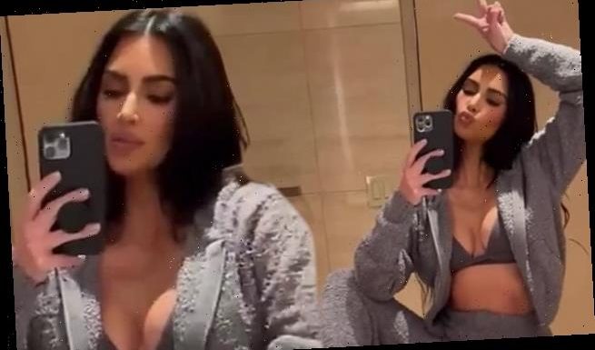 Kim Kardashian flashes toned tummy and ample bust in SKIMS Cozy