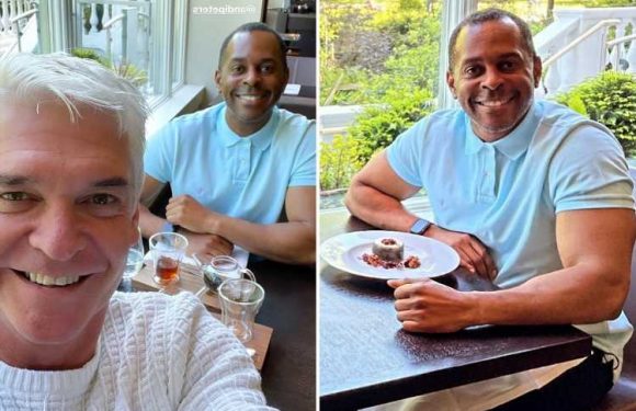 GMB's Andi Peters shows off bulging biceps during lunch with Phillip Schofield