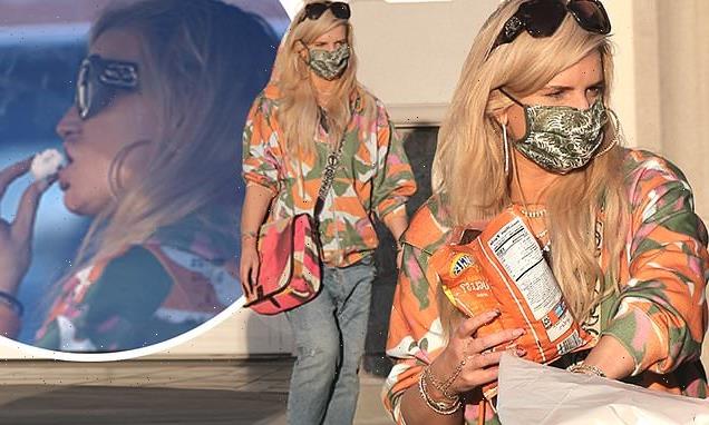 Jessica Simpson EXCLUSIVE: The star is seen munching on a donut