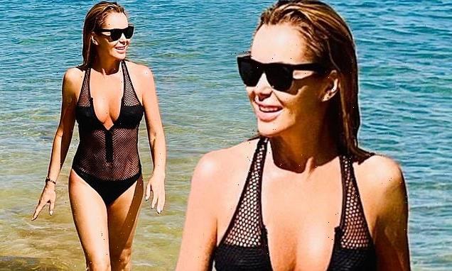 Amanda Holden, 50, looks incredible in plunging mesh swimsuit