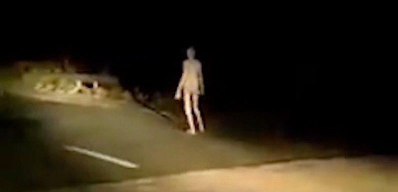 Creepy ‘alien’ figure with long limbs walks along bridge at dead of night