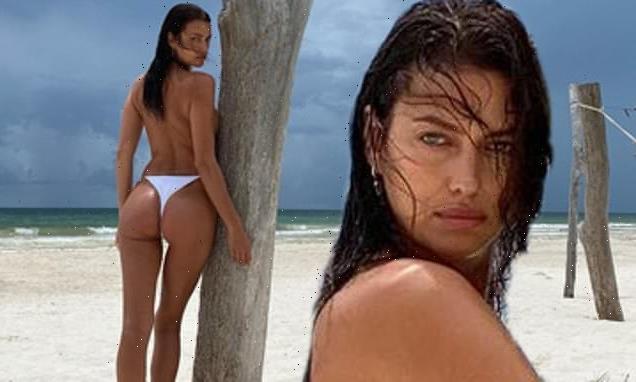 Irina Shayk goes TOPLESS on the beach while enjoying a sunny 'escape'