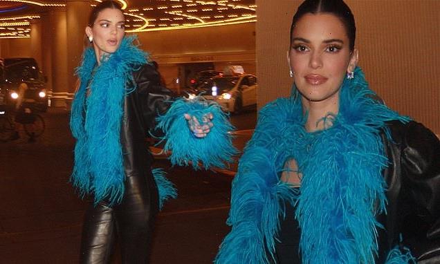 Kendall Jenner wears a blue feather boa down the Las Vegas Strip