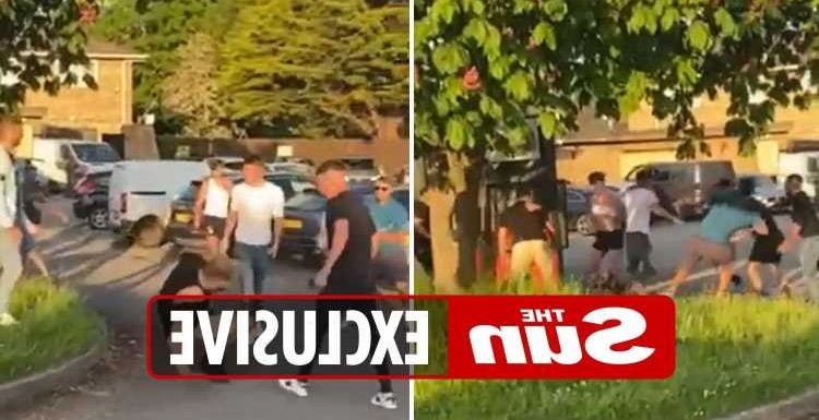 Terrifying moment boozers throw glass bottles at each other in car park pub brawl after man 'urinated on grave stone'