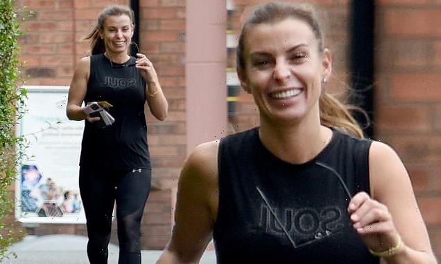 Beaming Coleen Rooney jogs out of the gym in tight workout gear