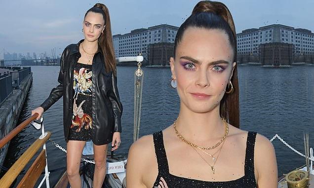 Cara Delevingne stuns in a thigh-skimming black dress at boat party