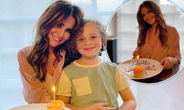 Cheryl poses with Kimberley Walsh's son while celebrating her birthday