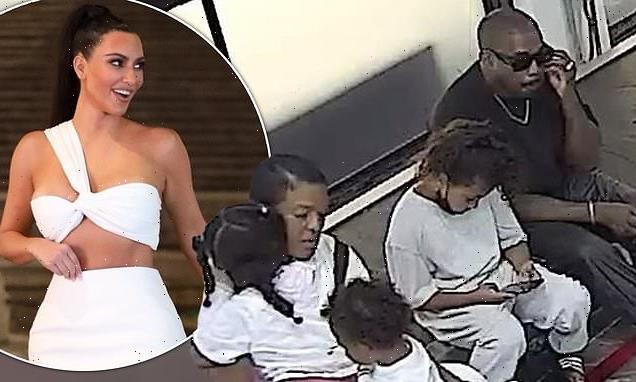 Kanye West is on daddy duty as he arrives at Mexico Airport with kids