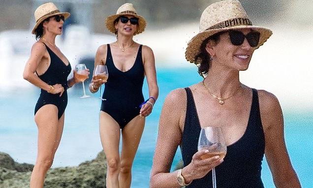 Lauren Silverman enjoys rosé wine on the beach in Barbados