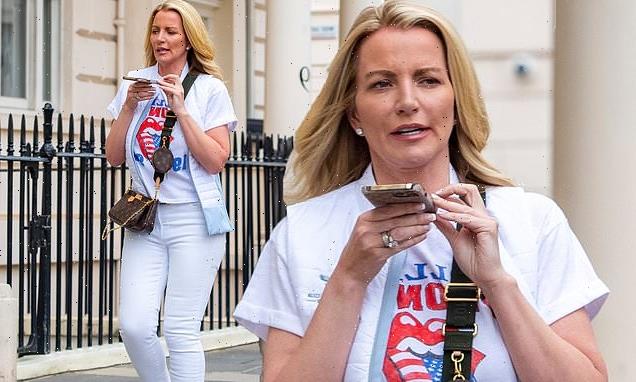 Michelle Mone shows off her trim figure in white skinny jeans