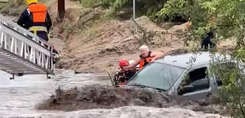 Arizona rescuers save 3 people trapped in vehicle from raging floodwaters, dramatic video shows