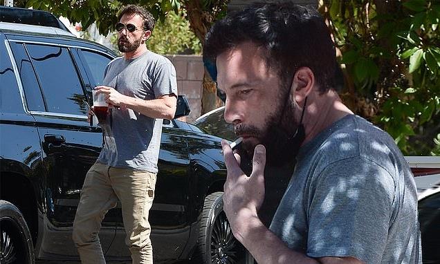 Ben Affleck puffs on a cigarette as he is pictured back in LA