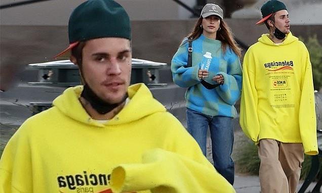 Justin models flowing Balenciaga hoodie as he steps out with Hailey