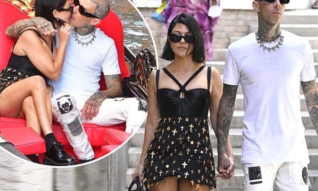 Kourtney Kardashian and Travis Barker hold hands during Venice stroll