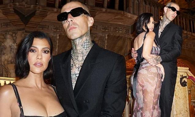 Kourtney Kardashian smolders in a sheer dress with Travis Barker