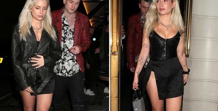 Lottie Moss stuns in a high-split skirt and corset during date night with Tristan Evans