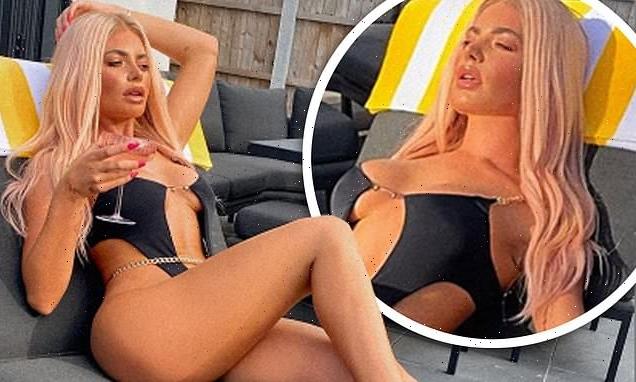 Megan Barton Hanson flaunts her figure in a VERY racy cut-out swimsuit