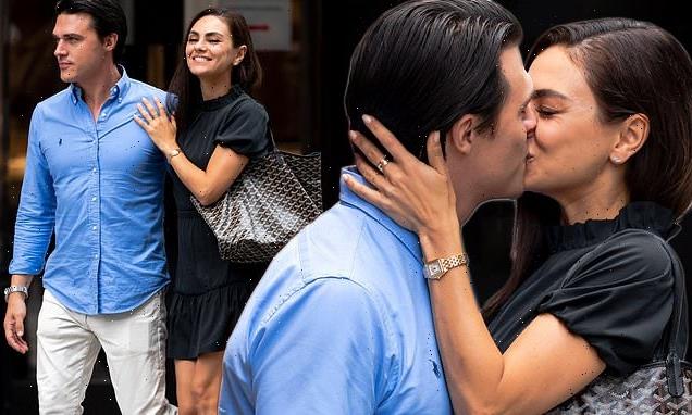 Mila Kunis shares a passionate kiss with Finn Wittrock on set