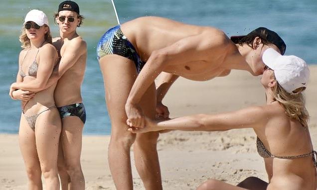 Olympian Ariarne Titmus with boyfriend Kyle Niesler at Noosa Beach