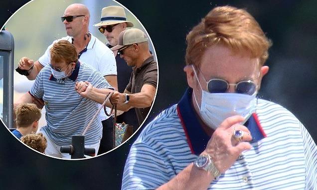 Sir Elton John dresses up in Gucci for family lunch in Cannes